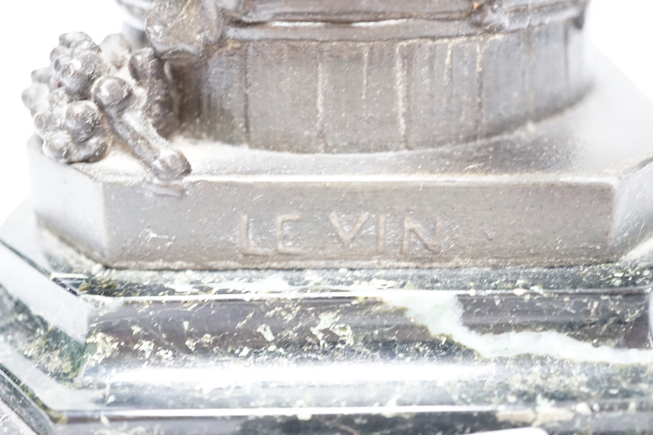 A bronzed spelter dancing figure of Bacchus - ‘Le Vin’, with a fawn and bunches of grapes, on a marble base, 36cm high